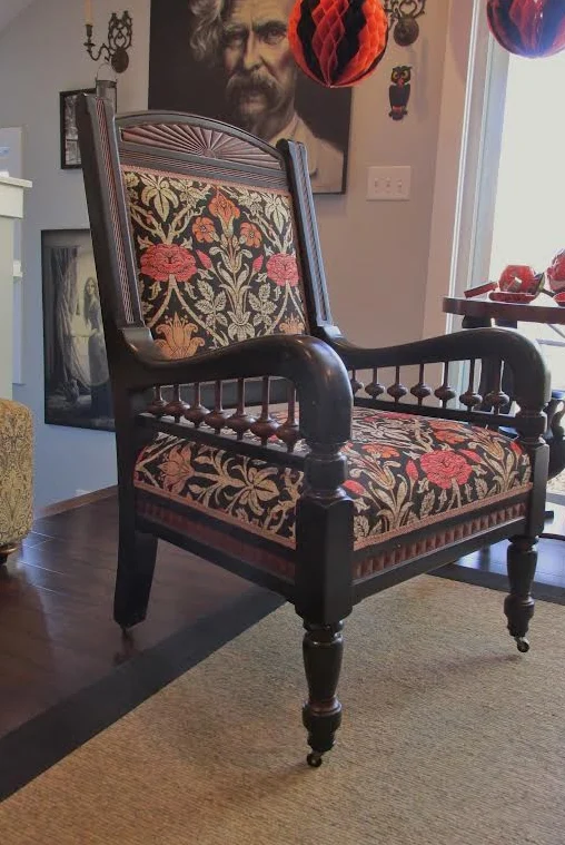 Eastlake carved-oak armchair in black and rust Morris tapestry